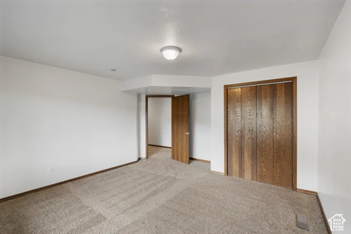 Neutral wall finishes and carpeted flooring