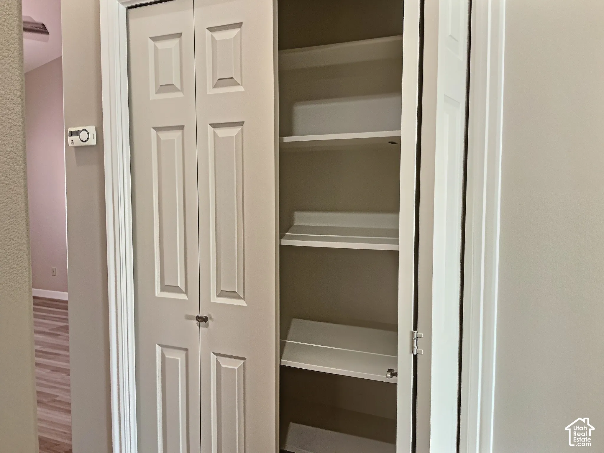 Bi-fold doors opening to built-in shelving