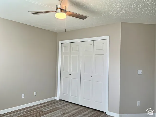 Wood-finish flooring with white baseboards