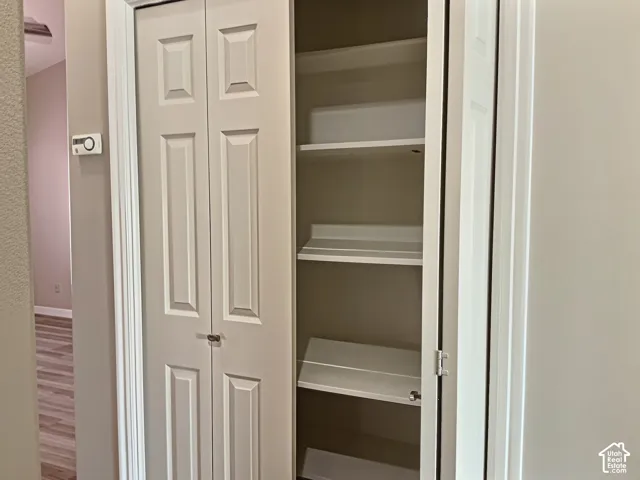 Bi-fold doors opening to built-in shelving