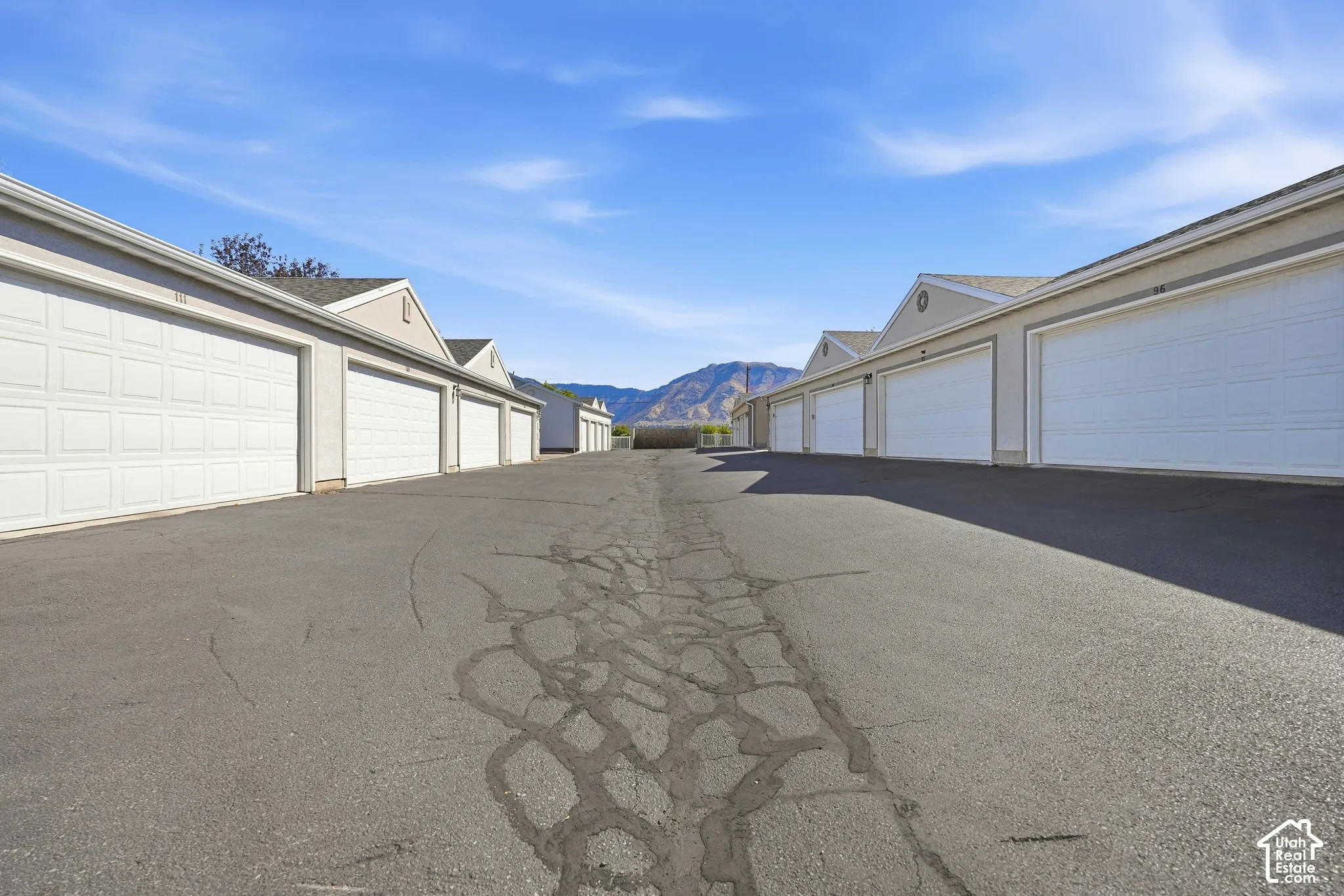 Row of individual garage bays with panel doors