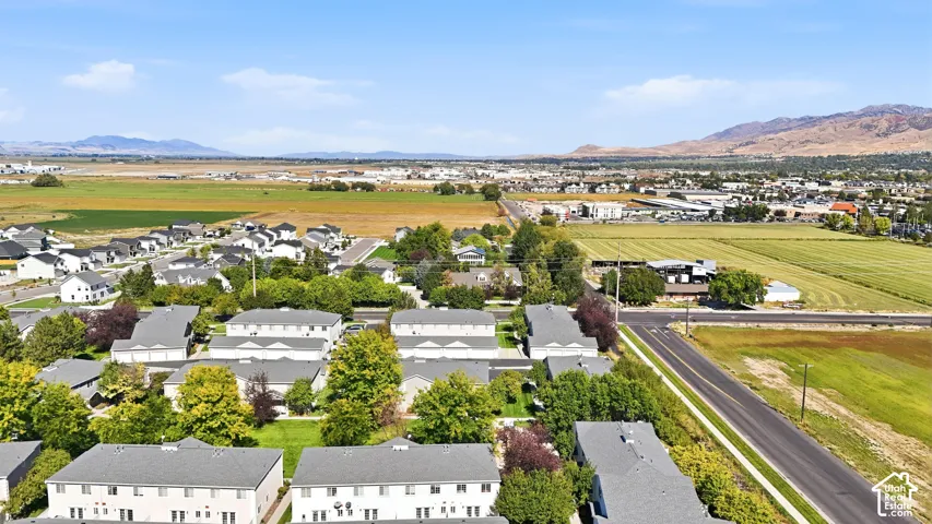 Expansive aerial perspective showcasing the surrounding landscape with distant mountains