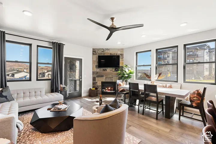 Spacious living area featuring wood-finish flooring, recessed lighting, and a modern ceiling fan