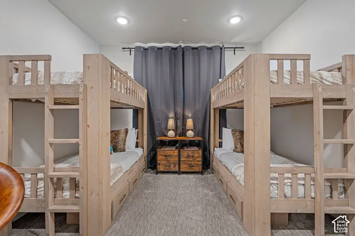 Two built-in bunk bed structures with integrated storage drawers