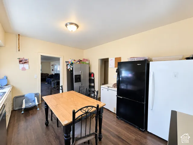 Kitchen area featuring wood-finish flooring, a flush-mount ceiling light fixture, and light-toned walls