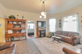 Living area with a decorative ceiling medallion and a multi-light pendant fixture