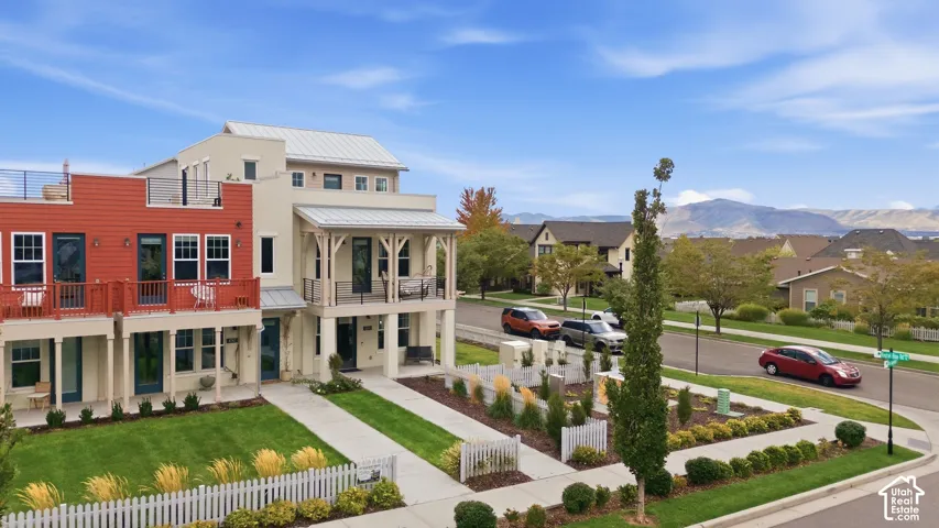 Multi-level residential structures with metal roofs and exterior siding