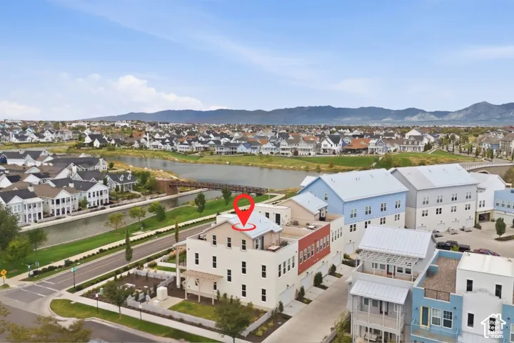 Aerial perspective showcasing a multi-story residence with a flat roof