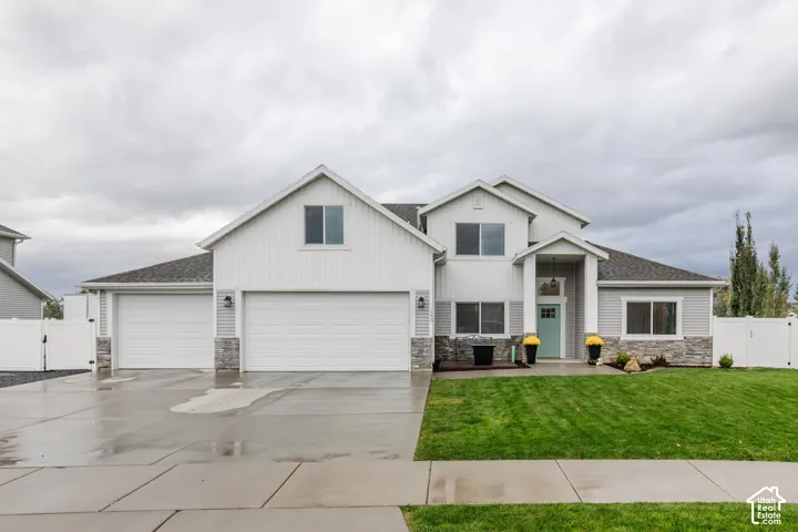 Contemporary exterior with light gray siding and white board and batten accents
