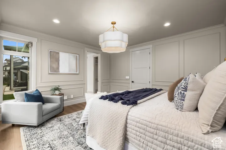 Recessed lighting, wood-finish flooring, and panel molding