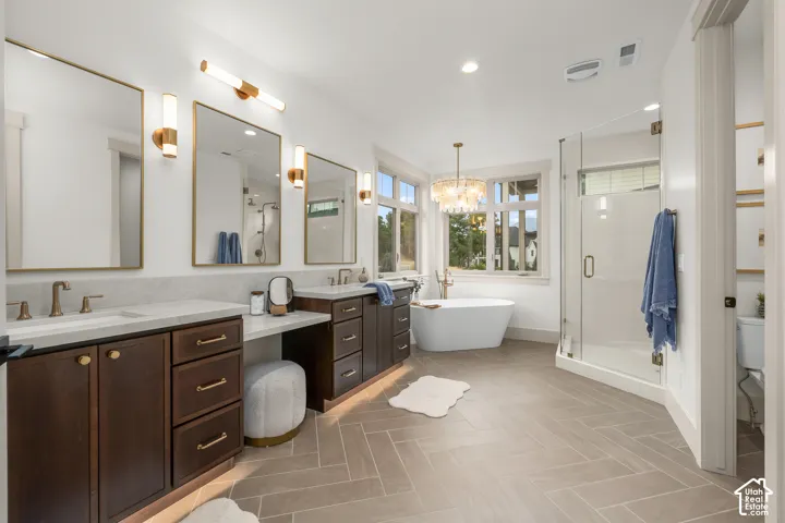 Dual dark wood vanities with integrated storage and light-toned countertops