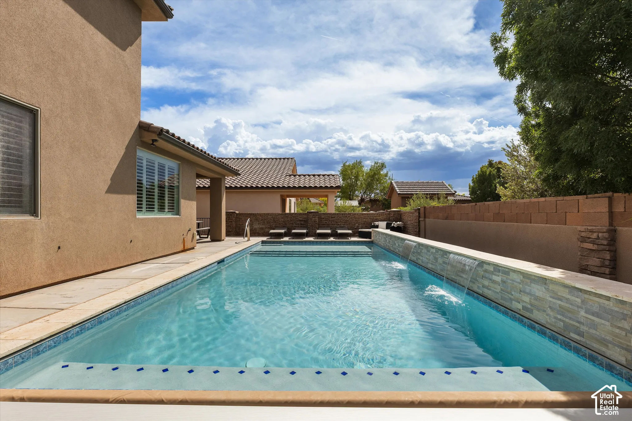 Heated pool with waterfalls, "Shamu shelf" and electronic cover.