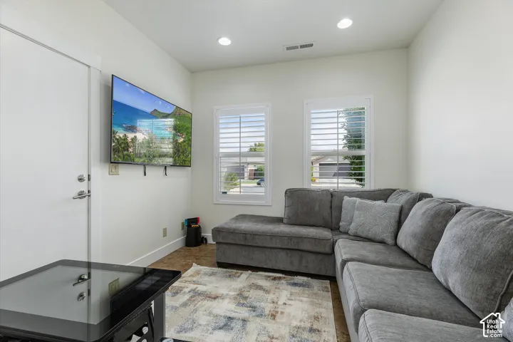 Den off of kitchen with exterior door.