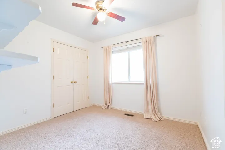 Textured carpeting with light-toned walls