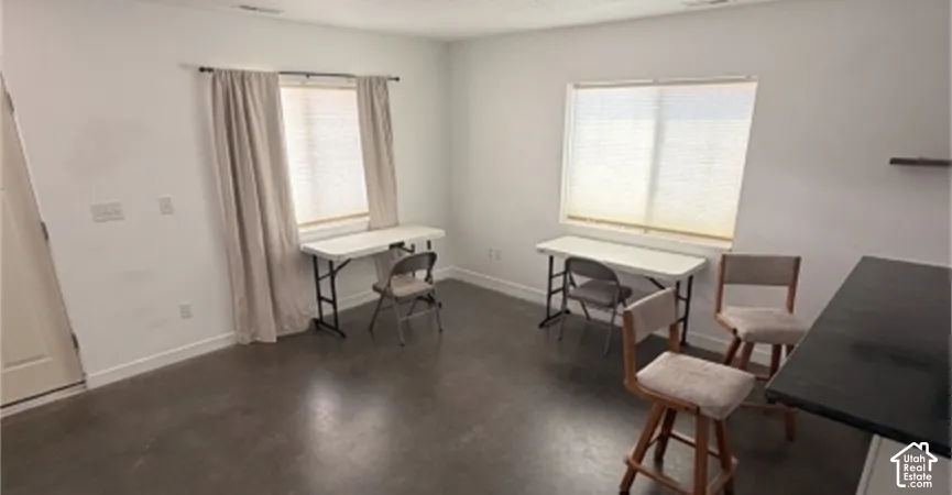 White walls and dark flooring