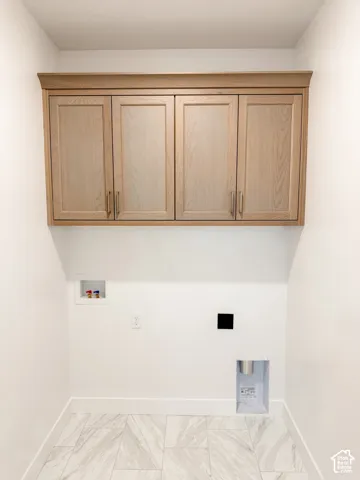 laundry room with cabinets