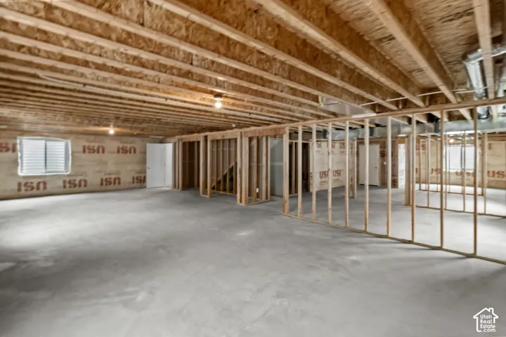 unfinished bedroom with potential for 3 more bedrooms, extra large great room, and another full size bathroom.