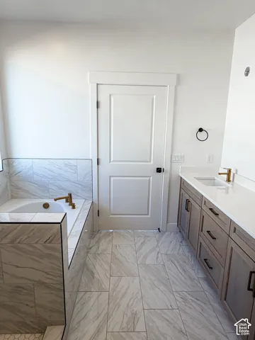 Primary bathroom  will have glass doors around the walk in shower as well as mirrors installed.