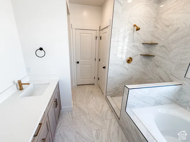 Primary bathroom  will have glass doors around the walk in shower as well as mirrors installed.