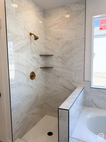 Primary bathroom  will have glass doors around the walk in shower as well as mirrors installed.