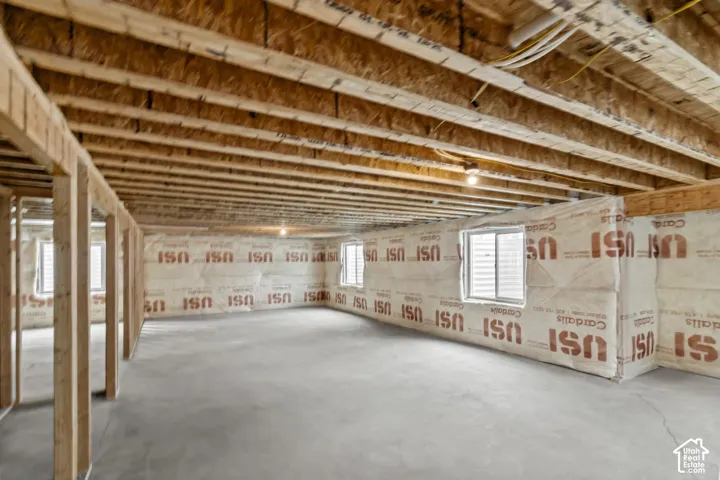 unfinished bedroom with potential for 3 more bedrooms, extra large great room, and another full size bathroom.