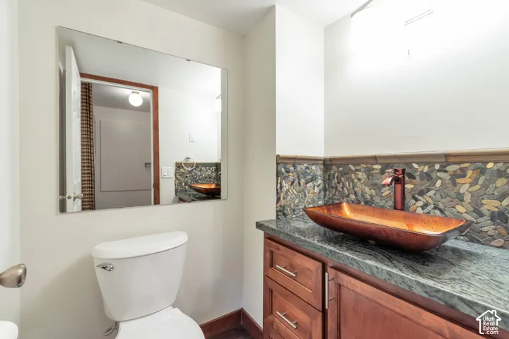Wood-finish flooring with a white toilet