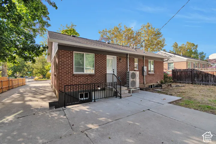 Back of house with basement entrance