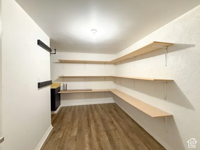 Wood-finish flooring with white baseboards