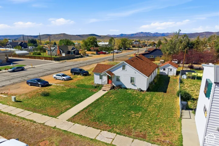 Charming single-story residence situated on a generous lot with mature landscaping and manicured lawn