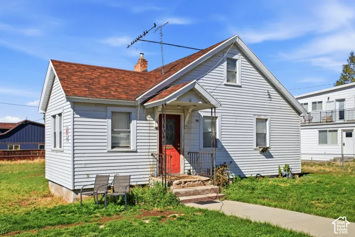 Gable roofline with shingle roofing and white siding exterior