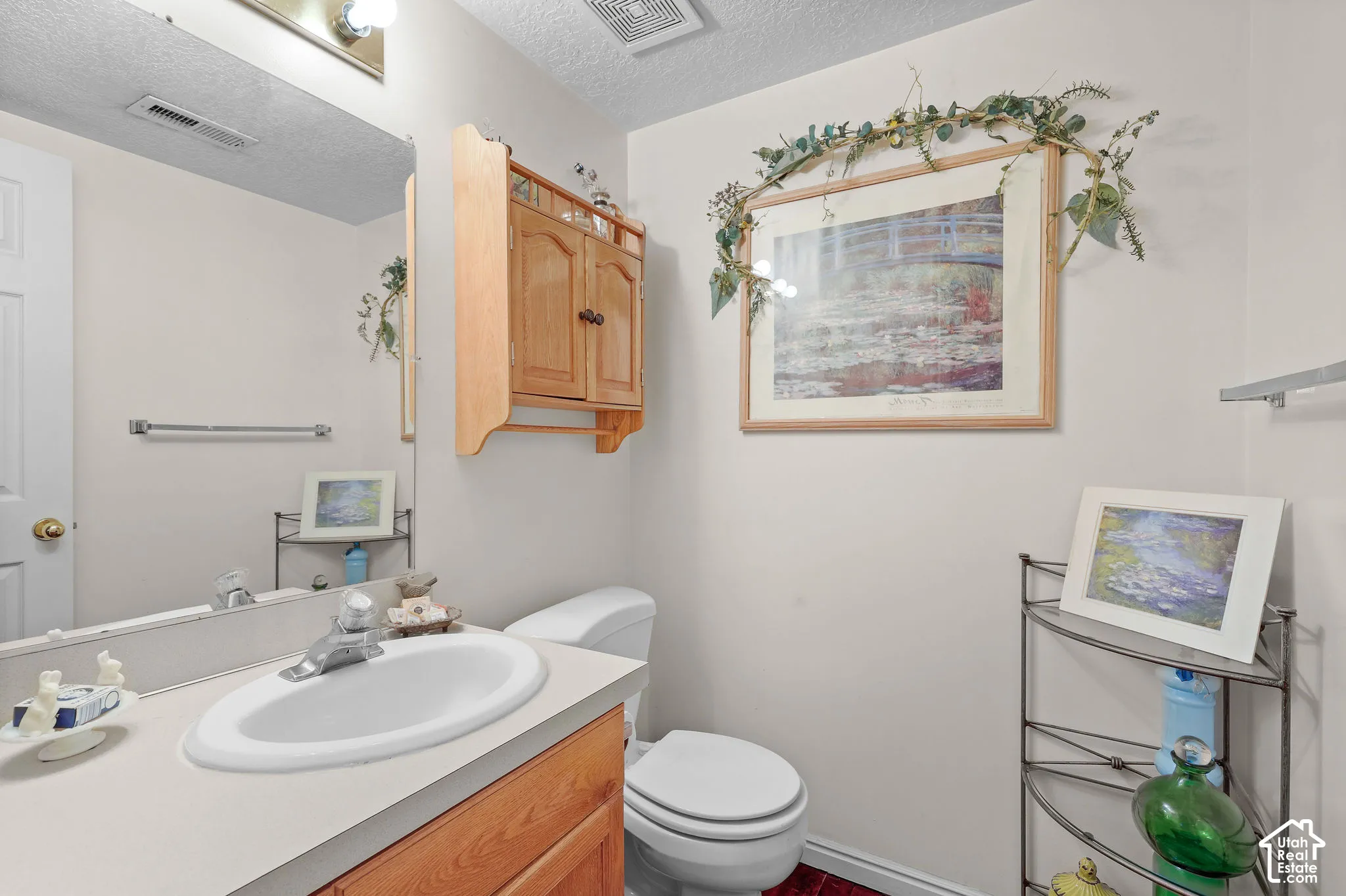 Unit A, Bathroom vanity with a sink, a chrome faucet, and a large wall mirror