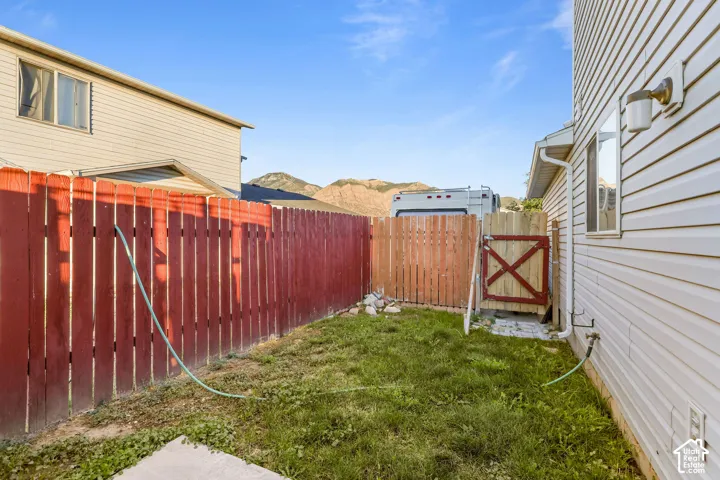 Unit B, Fenced side yard with a grass area