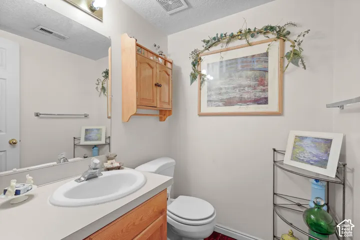 Unit A, Bathroom vanity with a sink, a chrome faucet, and a large wall mirror