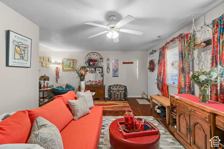 Unit A, Ceiling fan with light fixture, hard-surface flooring, and window with blinds