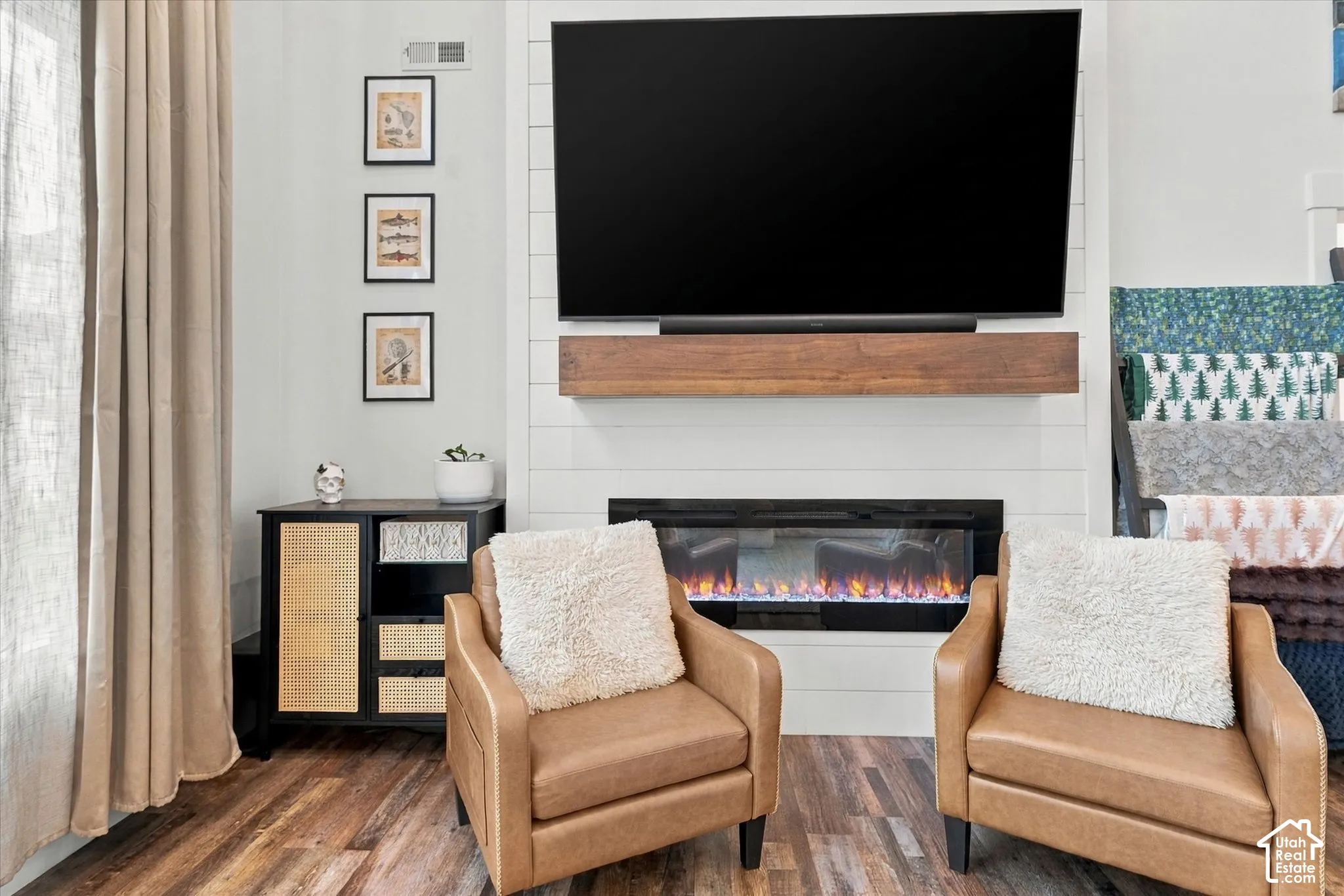 Shiplap fireplace with a wood-finish mantel and built-in electric firebox