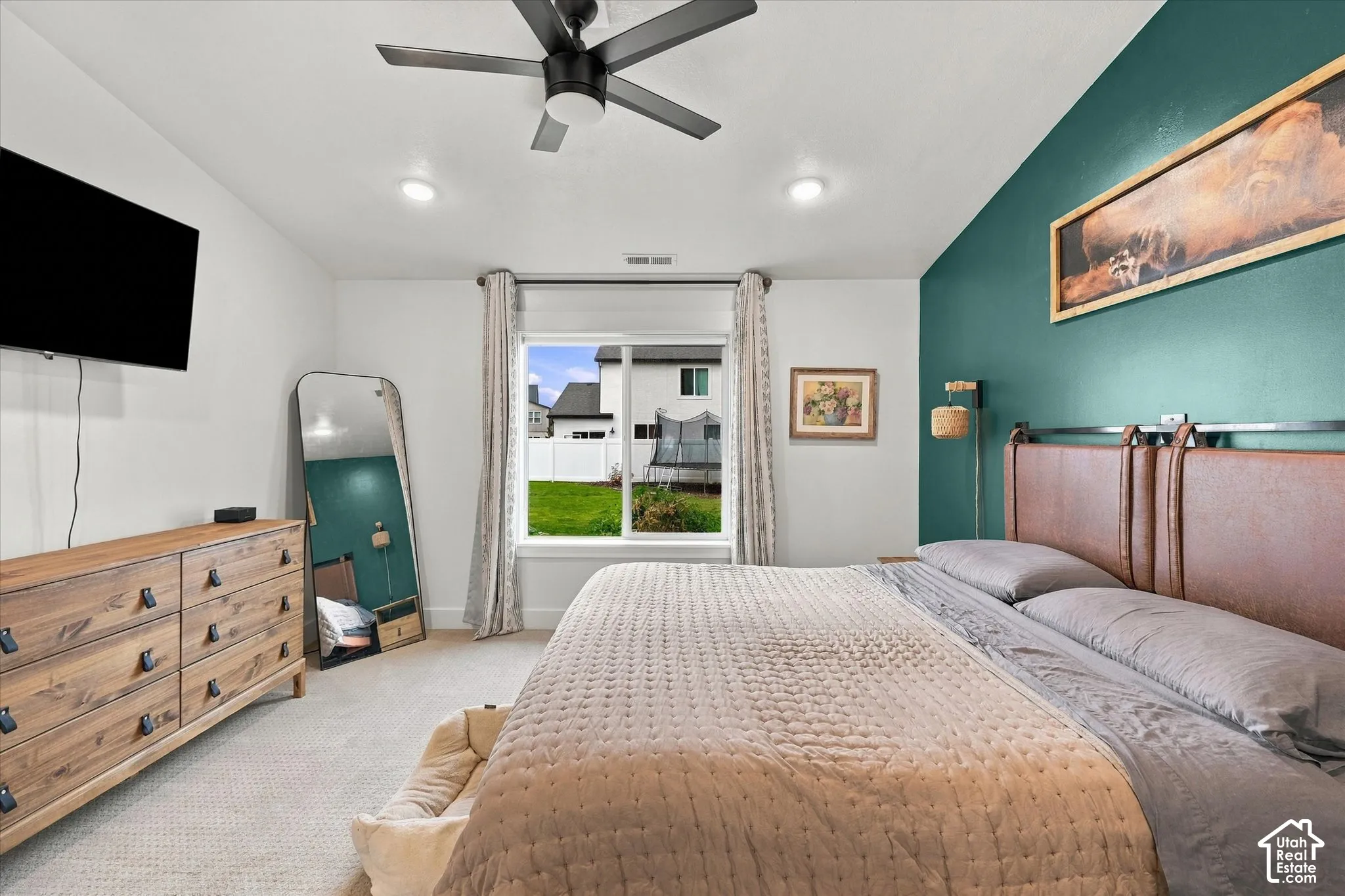 Recessed ceiling lighting, ceiling fan, and carpeted flooring