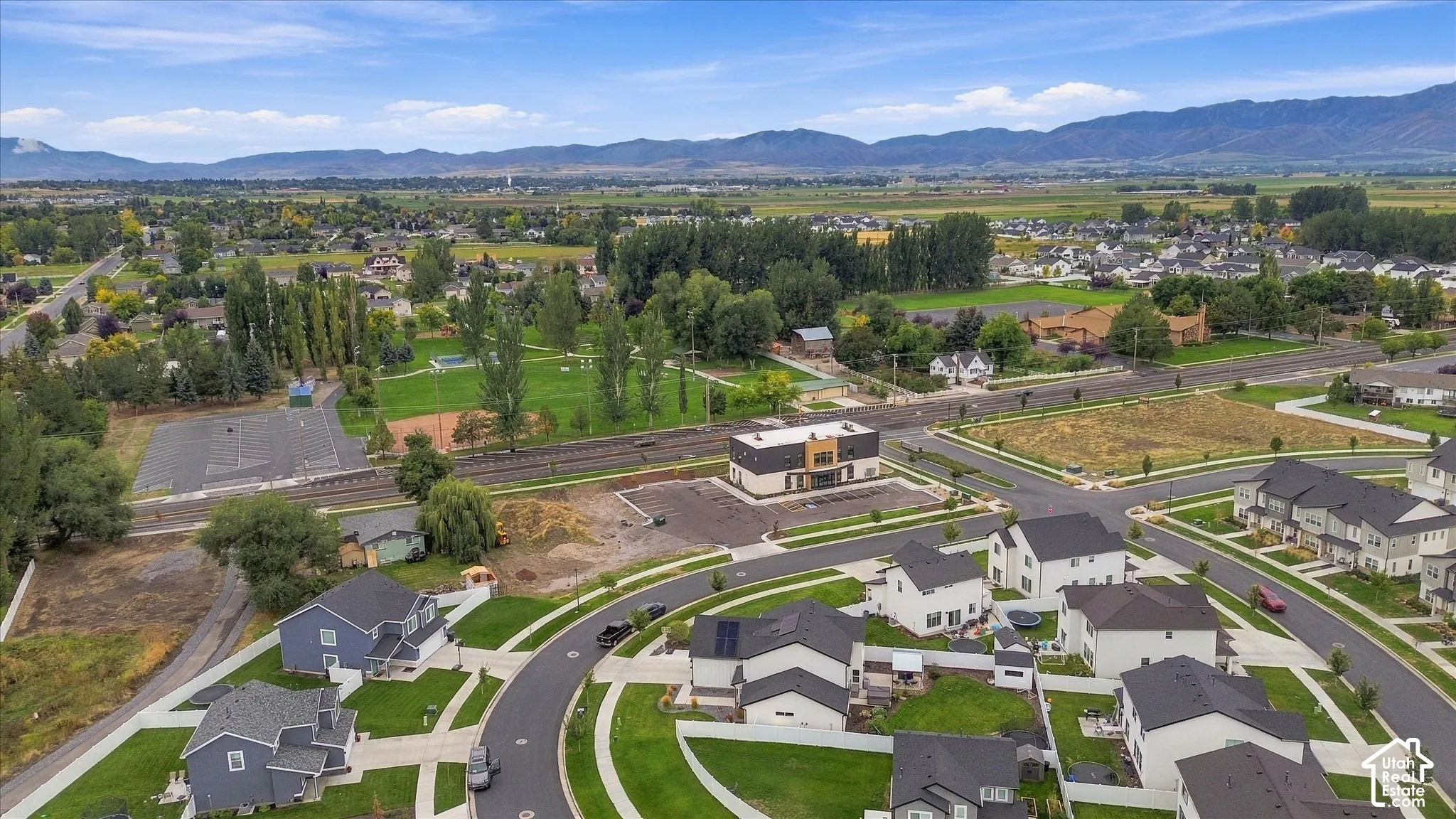Expansive mountain backdrop, established community setting, and well-maintained green spaces