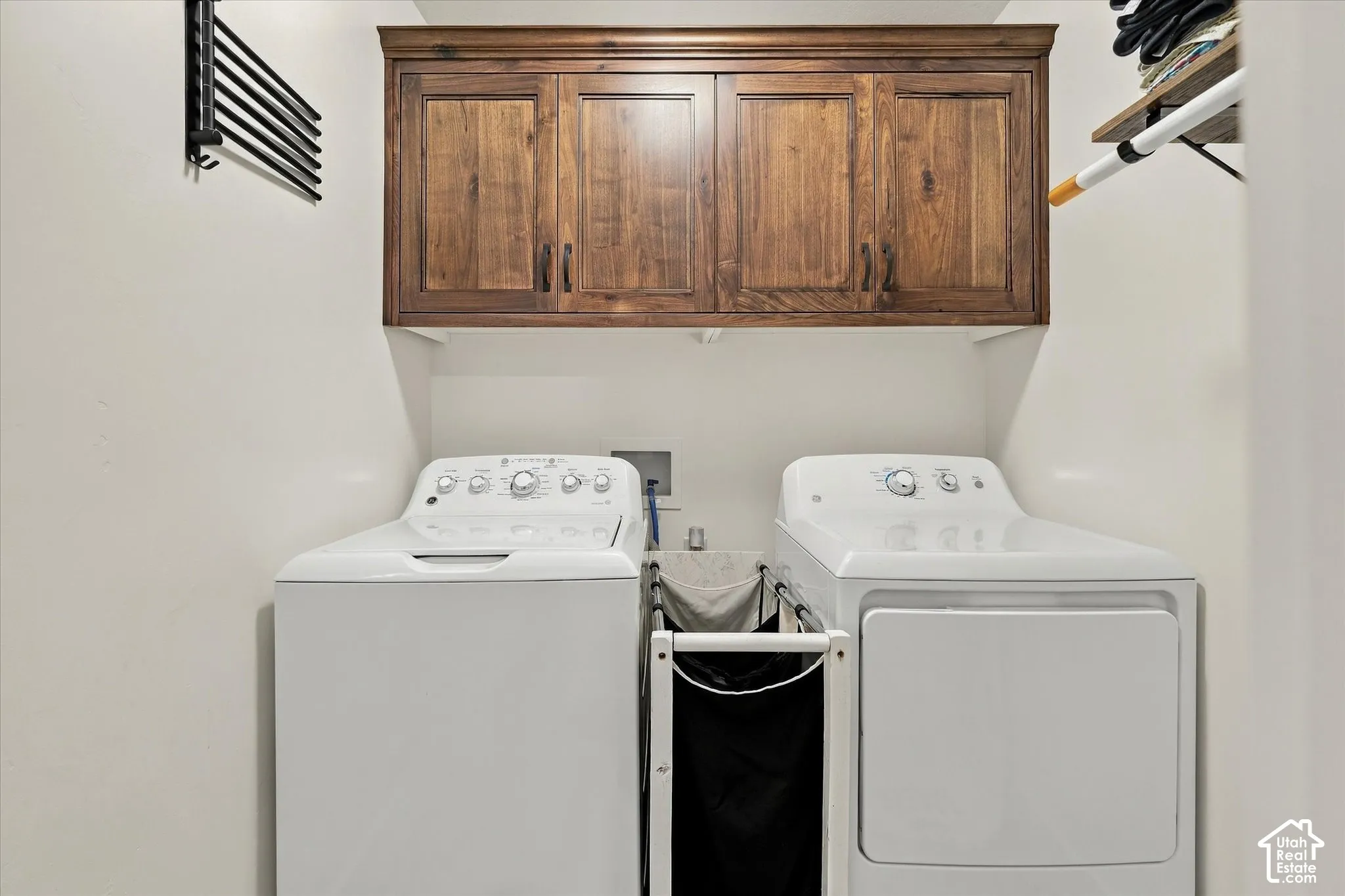 Built-in wood-finish cabinetry providing enclosed storage
