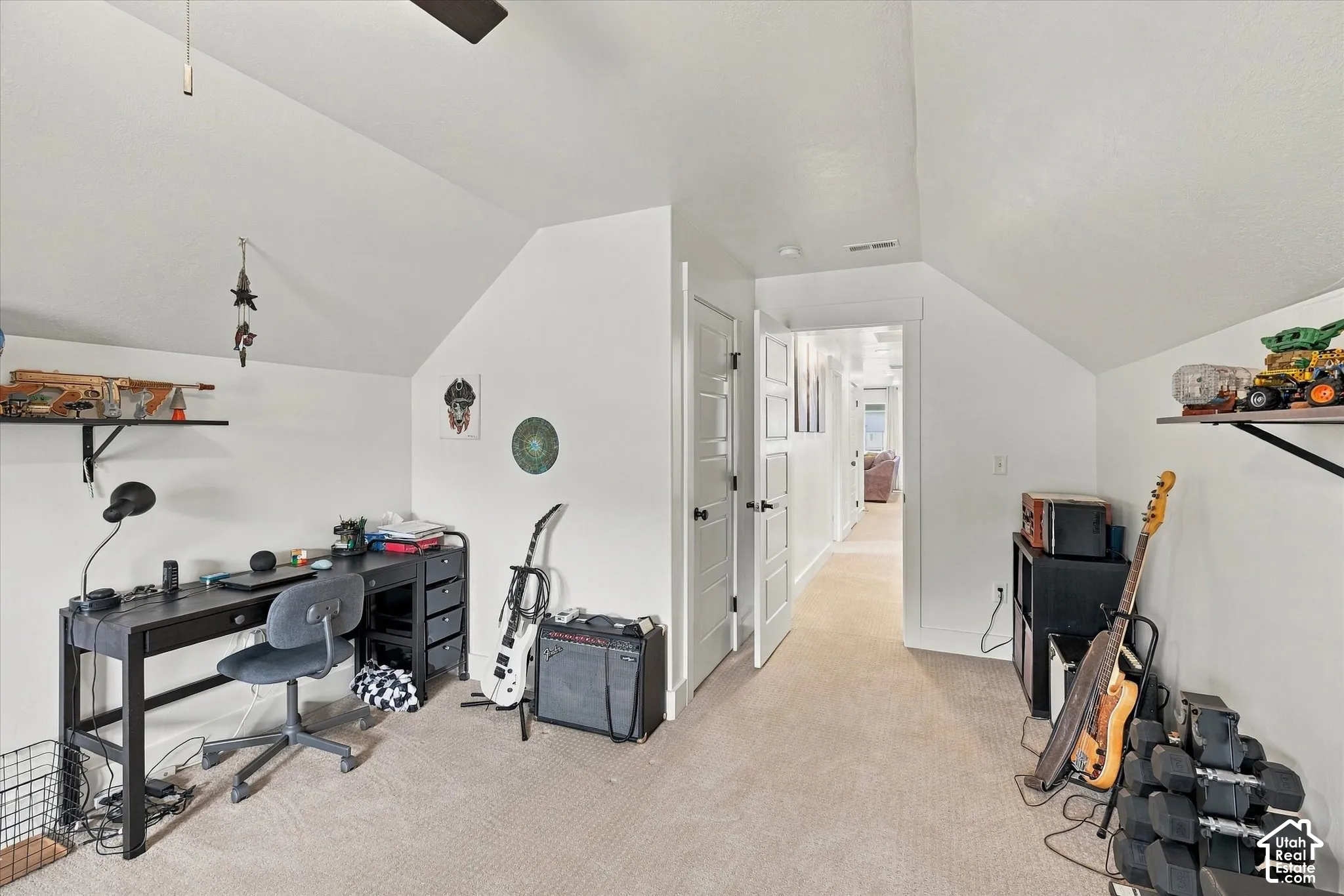 Carpeted flooring, sloped ceiling, recessed lighting, white interior doors, and a ceiling fan