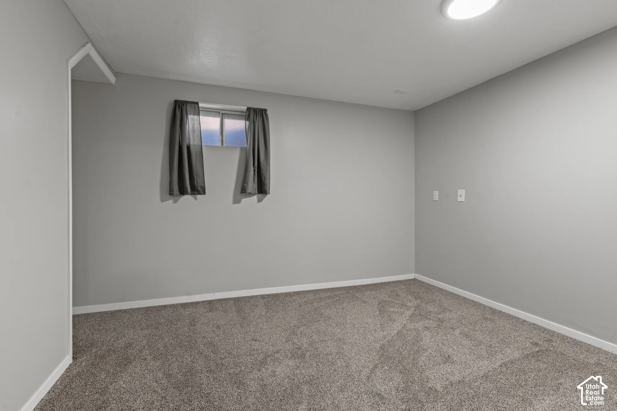 Wall-to-wall carpeting, recessed ceiling lighting, and neutral wall paint