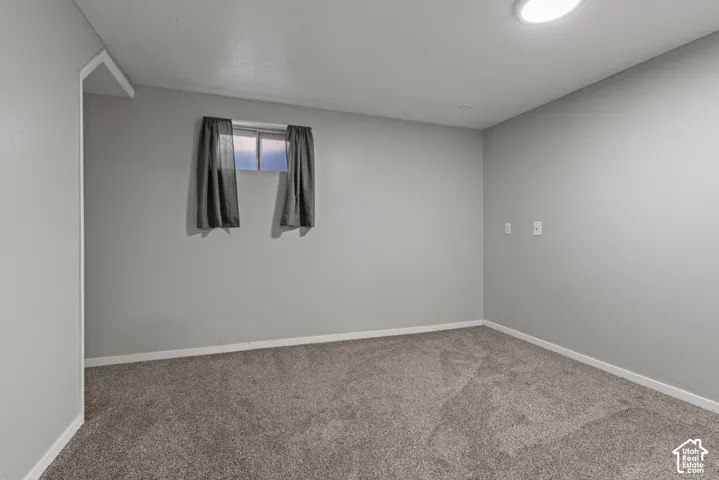 Wall-to-wall carpeting, recessed ceiling lighting, and neutral wall paint