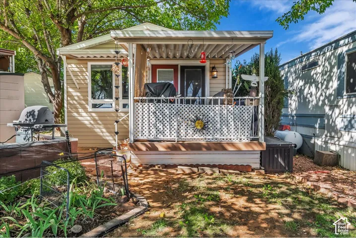 Covered front porch with white lattice railing