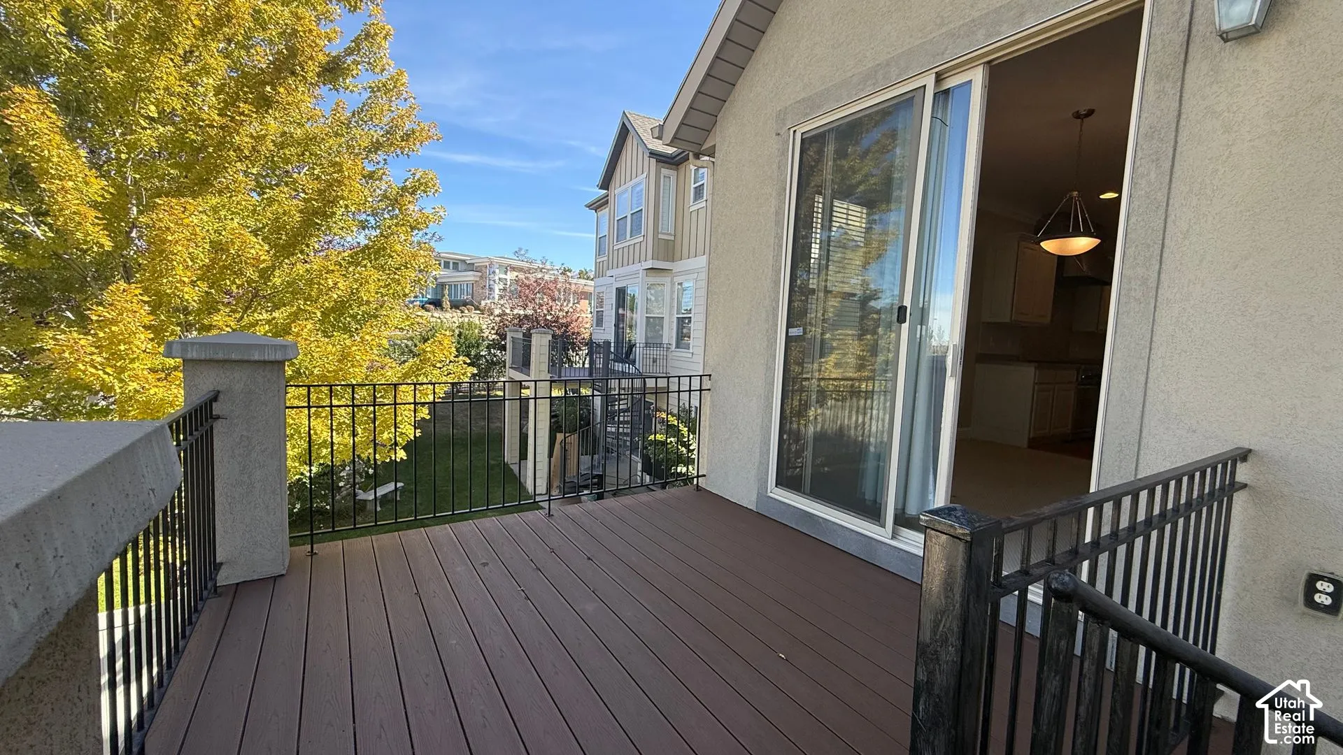 Expansive outdoor deck with composite decking and black metal railings