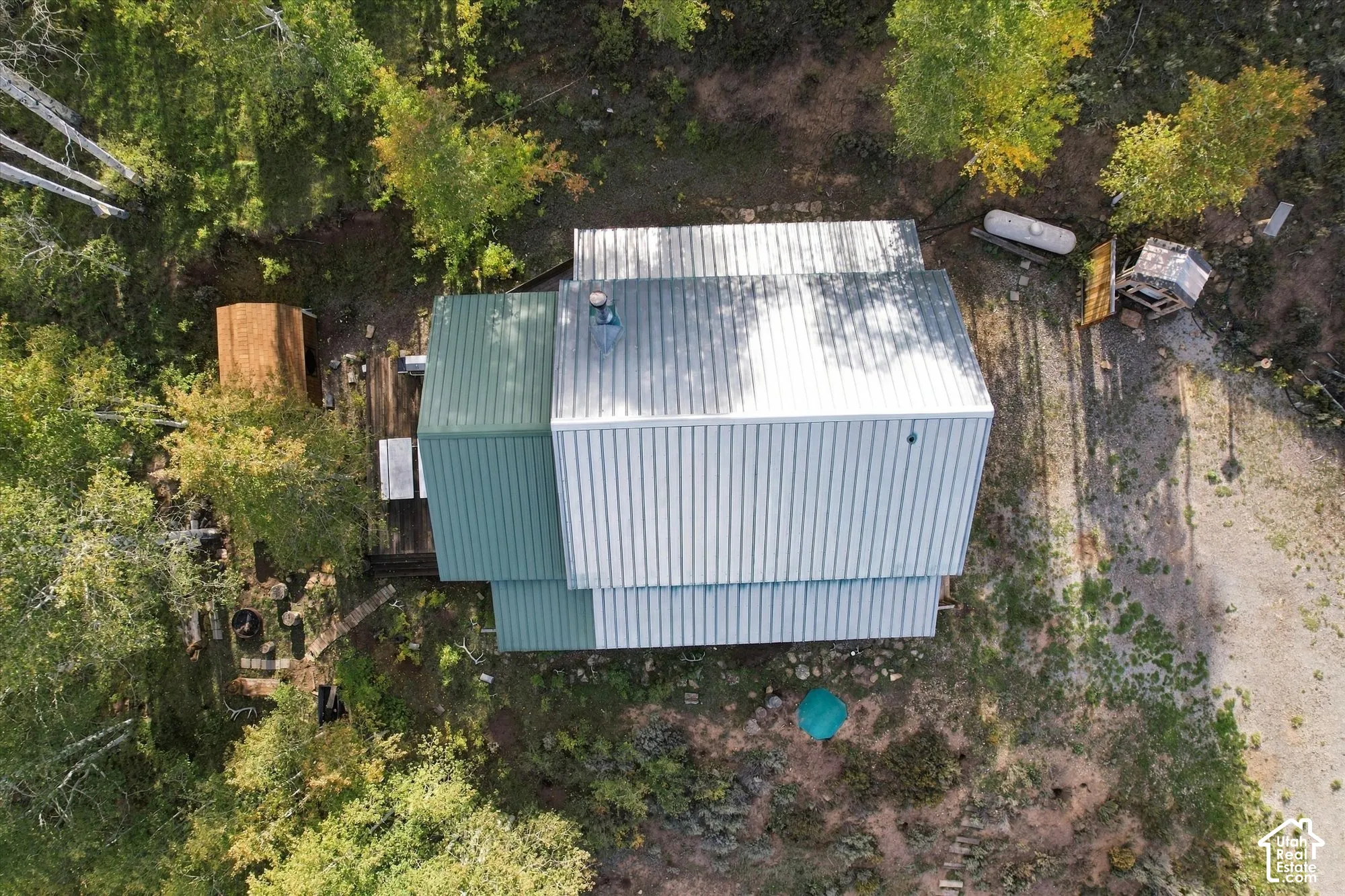 Metal roof structure with multiple pitches and dormers