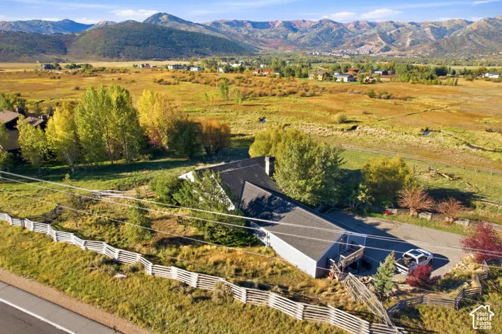 Expansive natural landscape with distant mountains and abundant green space