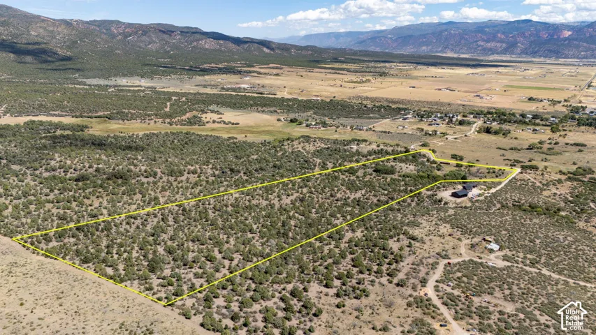 Expansive parcel featuring diverse natural terrain and distant mountain scenery