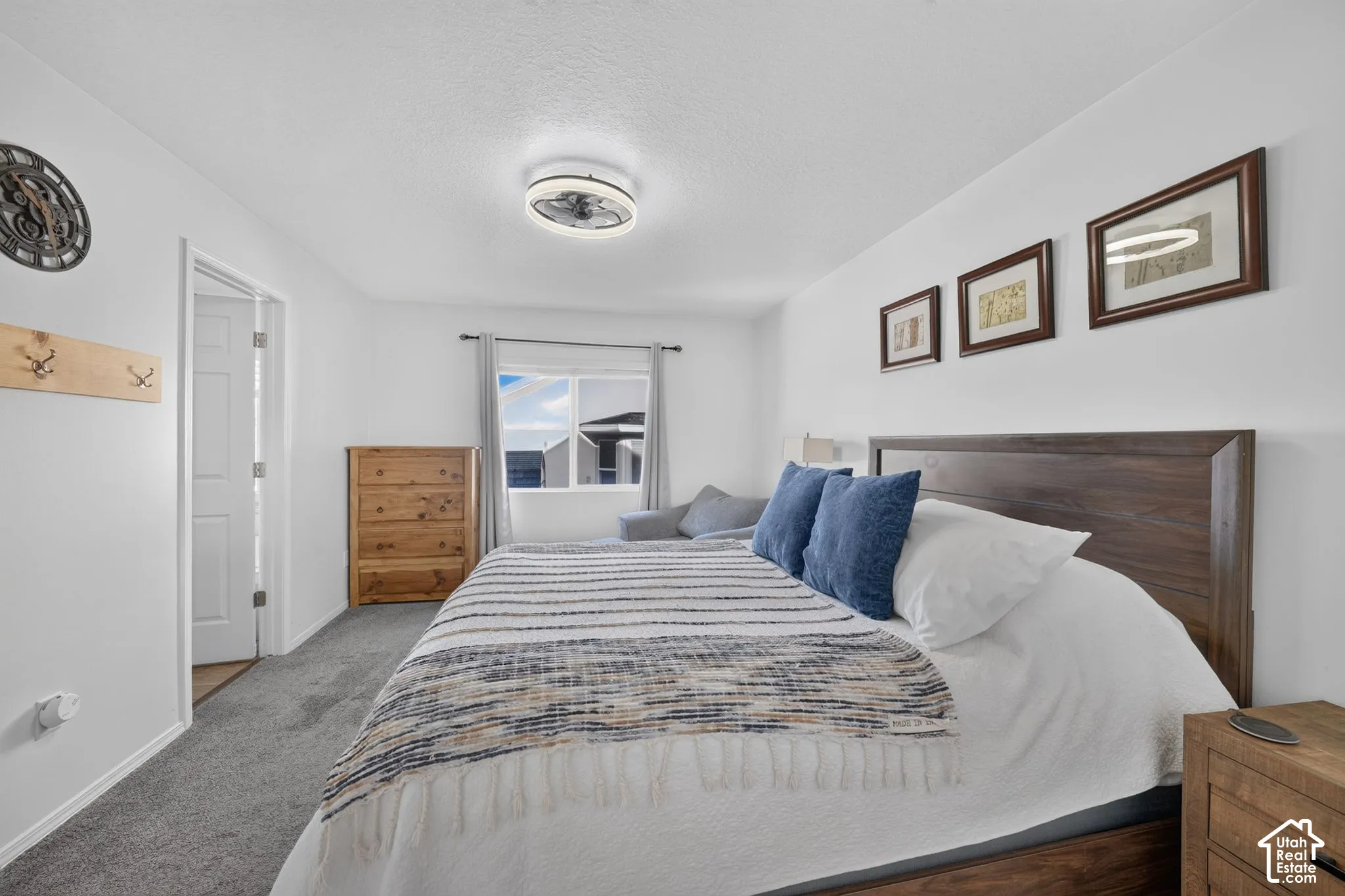 White interior walls with neutral carpeting