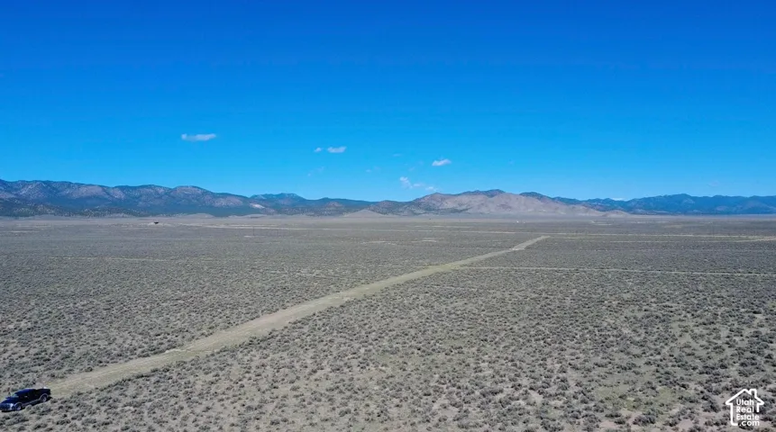 Expansive desert landscape with low-lying vegetation
