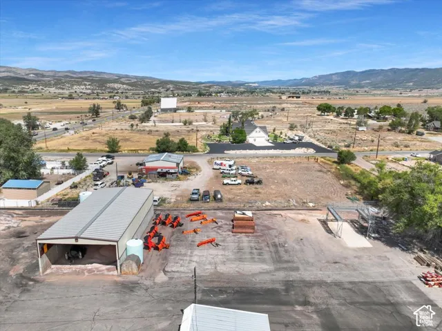 Expansive paved lot with a large metal-clad storage structure