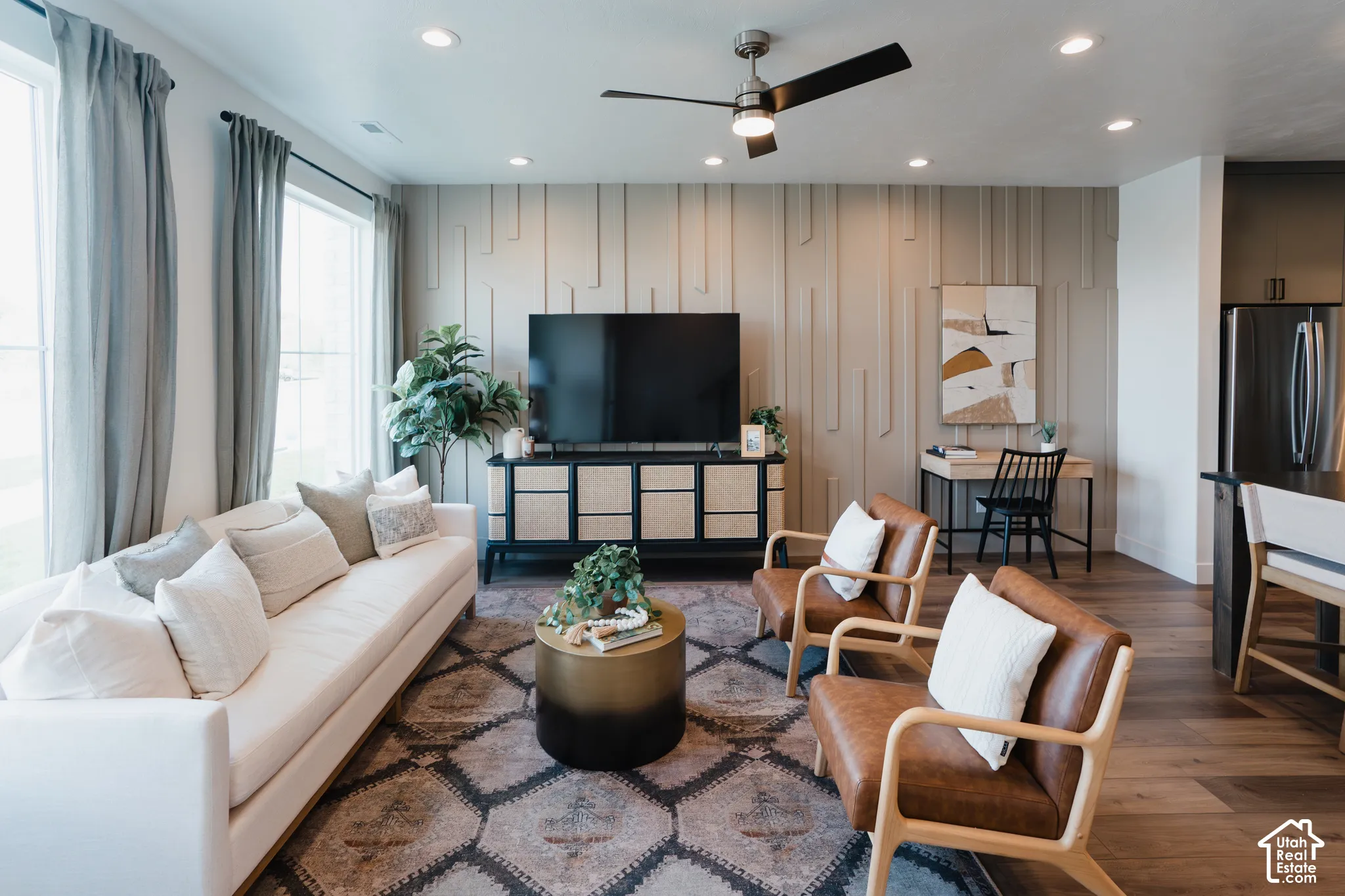 Recessed lighting illuminates wood-finish flooring
